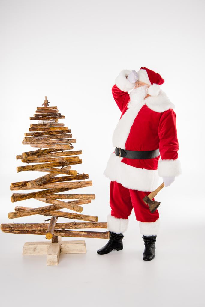 Tired Santa Claus with Christmas tree - Photo, Image