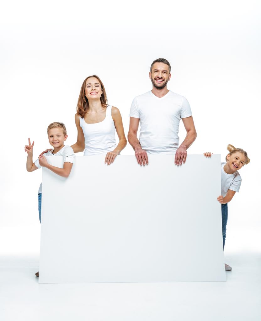 Happy family holding blank card - Photo, Image