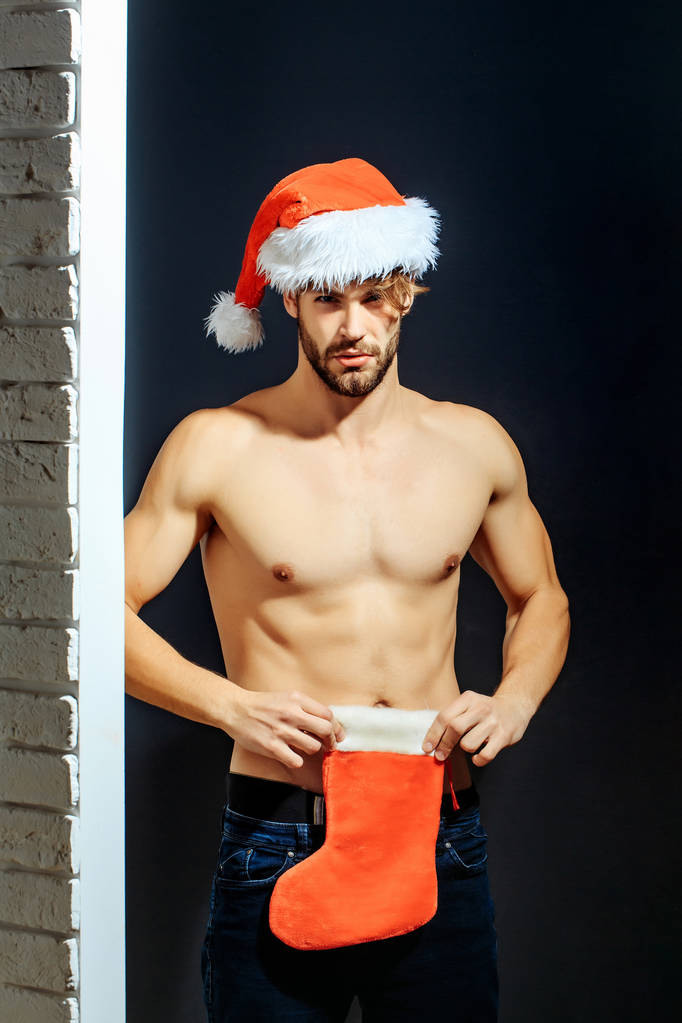 Різдвяний сексуальний м'язистий чоловік Санта
 - Фото, зображення