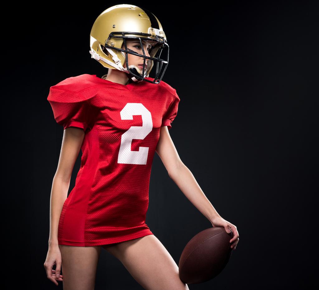 Feminino jogador de futebol americano em sportswear
 - Foto, Imagem