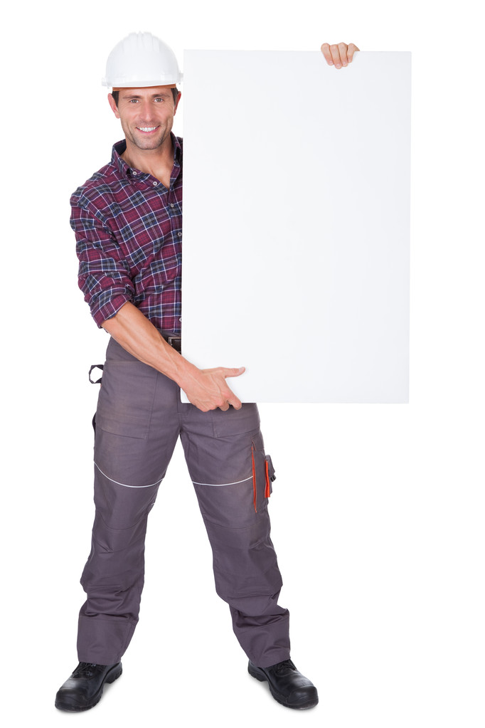 ο άνθρωπος φορώντας κράνη, κρατώντας πλακάτ - Φωτογραφία, εικόνα