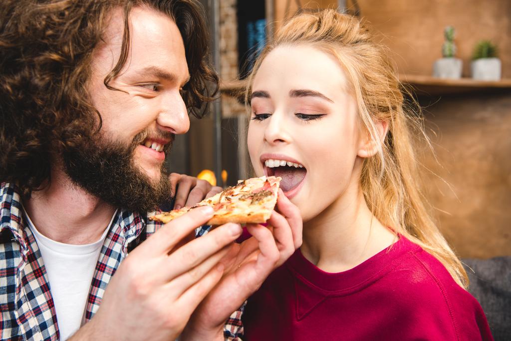 Couple eating pizza  - Photo, Image