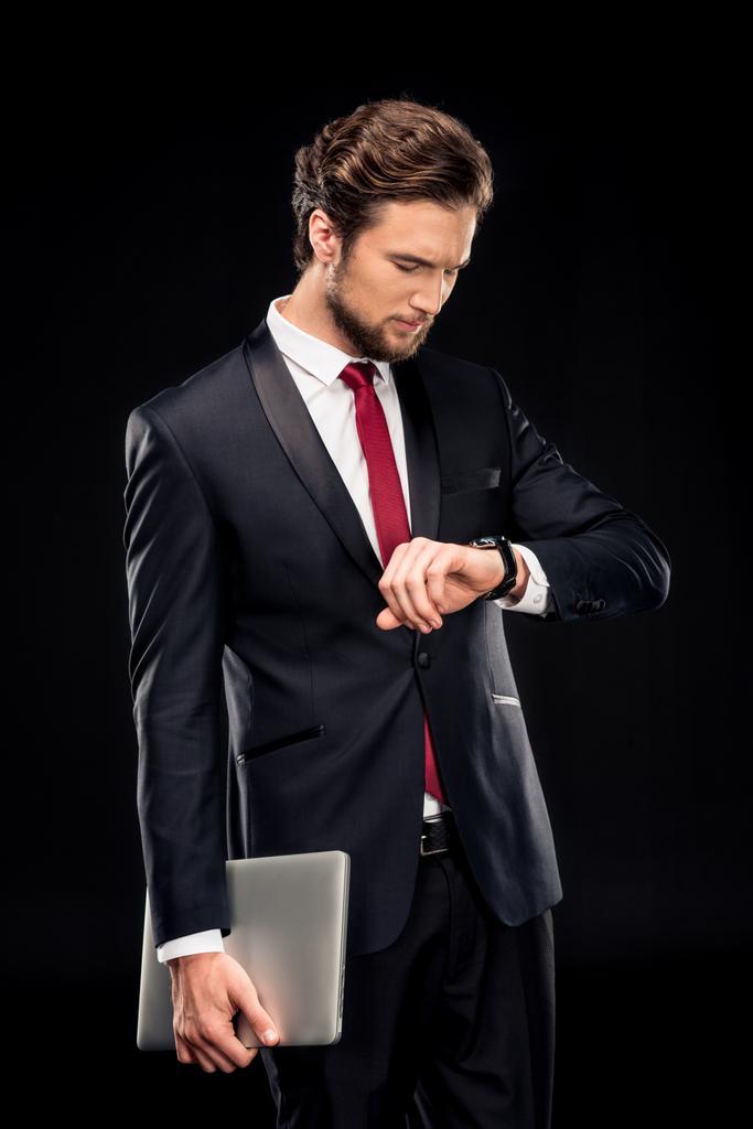 красивий бізнесмен тримає ноутбук
 - Фото, зображення