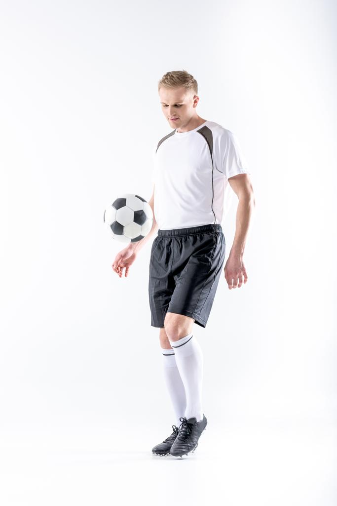 Jogador de futebol exercitando com bola
 - Foto, Imagem