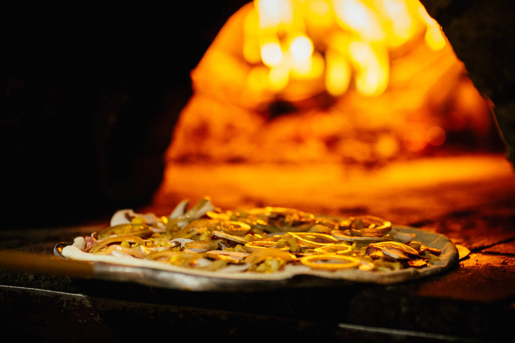 Pizza and brick pizza oven with fire - Photo, Image
