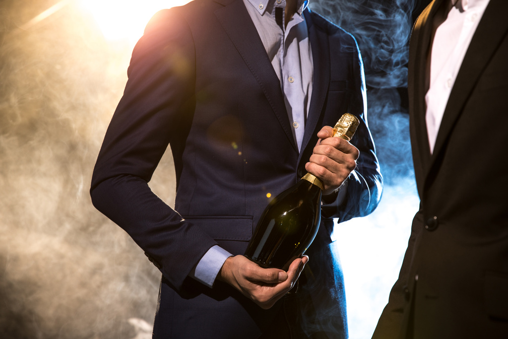 Stylish men with champagne bottle - Photo, Image