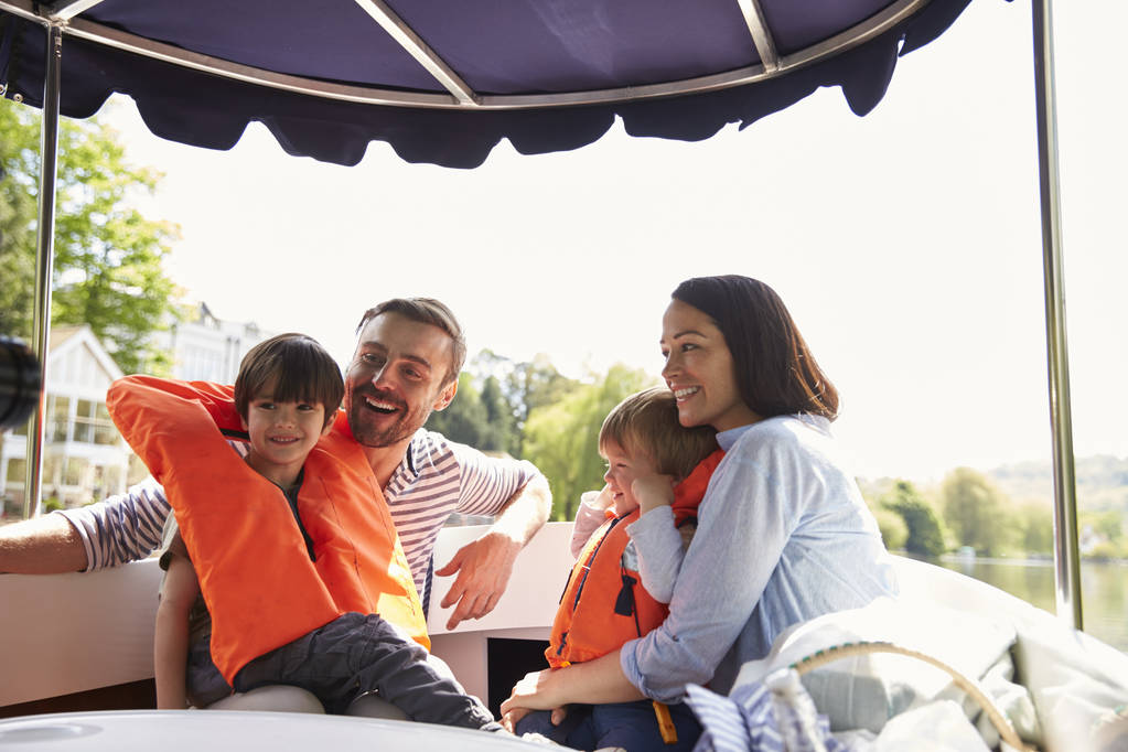 Family Enjoying Day Out In Boat  - Photo, Image