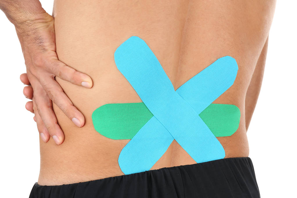 Physio tape on male lower back, close up - Photo, Image