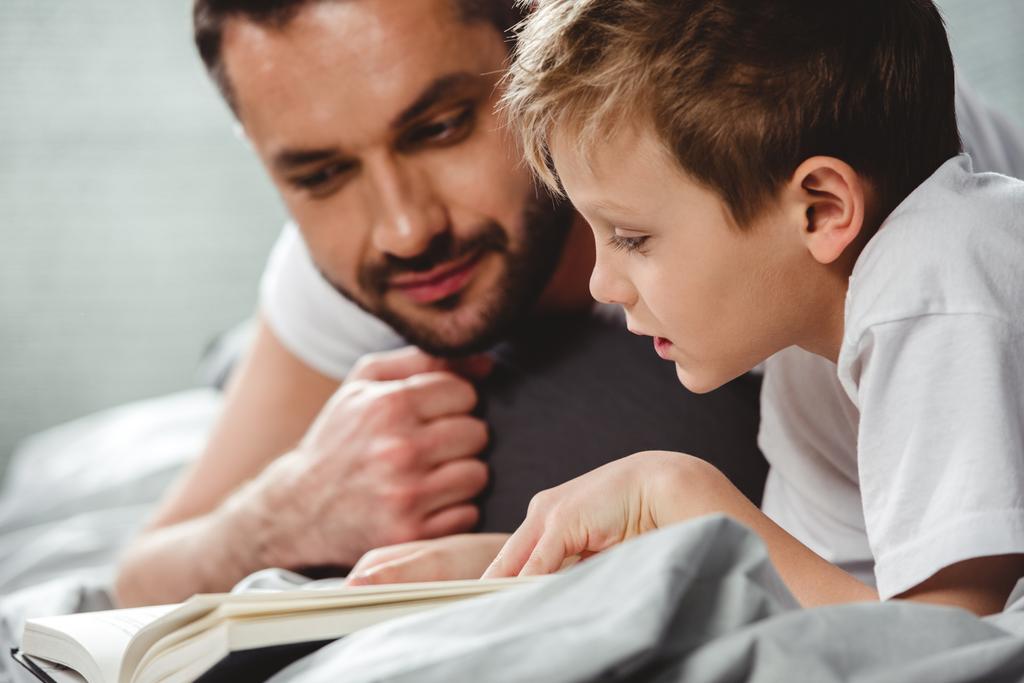 Father and son reading book  - Photo, Image