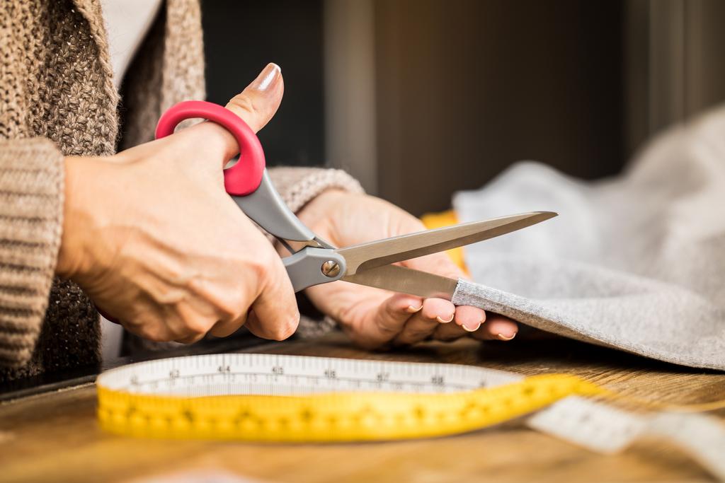 Woman cutting fabric  - Photo, Image