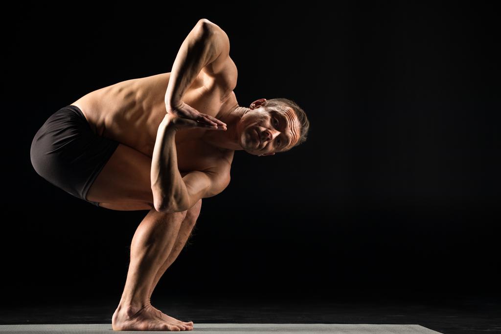 Man standing in yoga position - Photo, Image