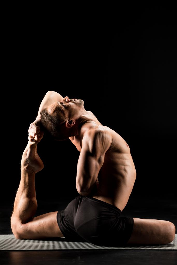 Man sitting in yoga position - Photo, Image