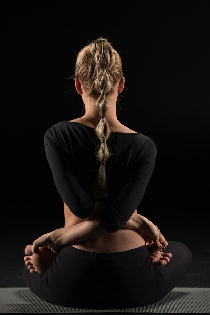 Woman sitting in yoga position - Photo, Image