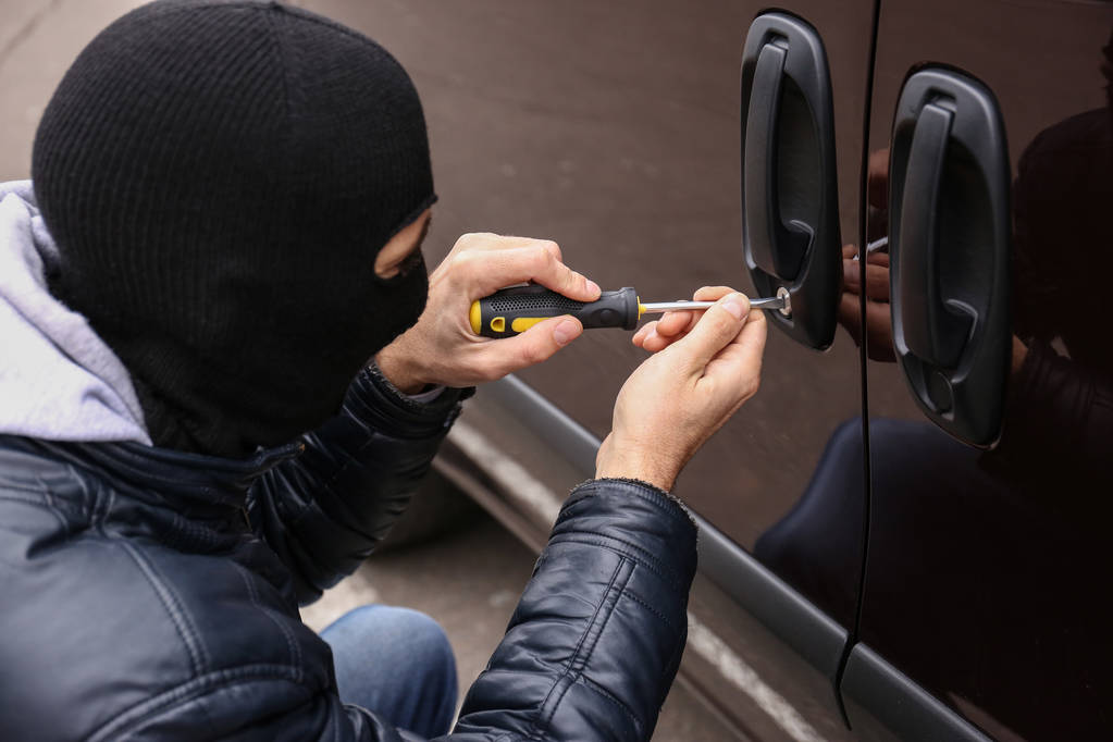 Man trying to break into car - Photo, Image