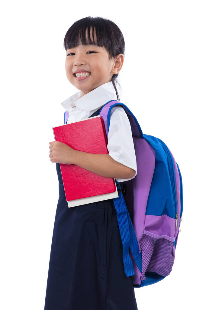Asiático chino poco escuela primaria chica sosteniendo libros con bolsa
 - Foto, Imagen