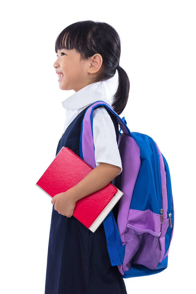 Asiatique chinois petite école primaire fille tenant des livres avec sac
 - Photo, image