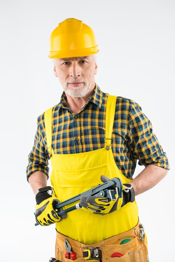 Trabajador maduro en sombrero duro
  - Foto, Imagen