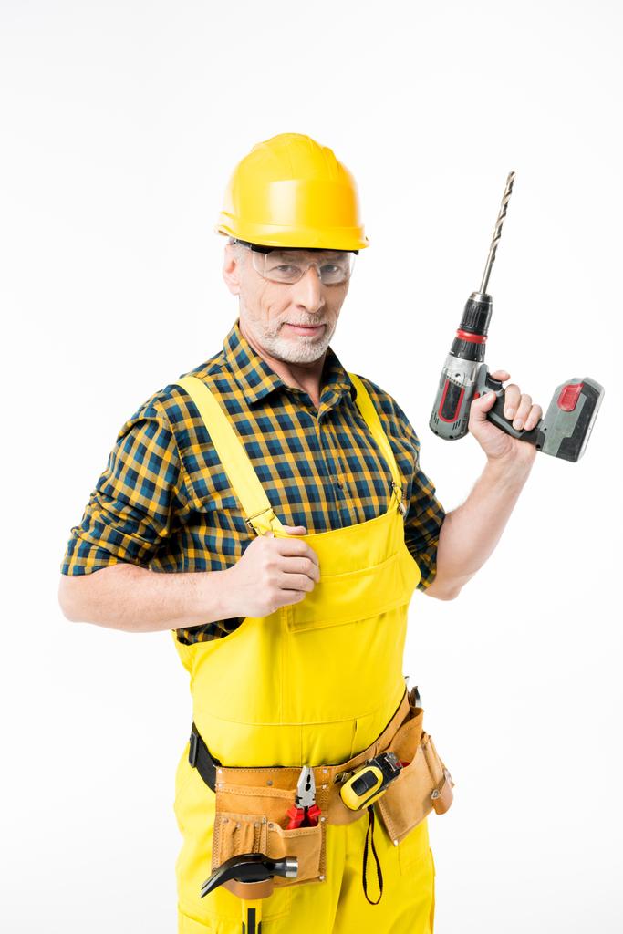 Workman houden van elektrische boor - Foto, afbeelding