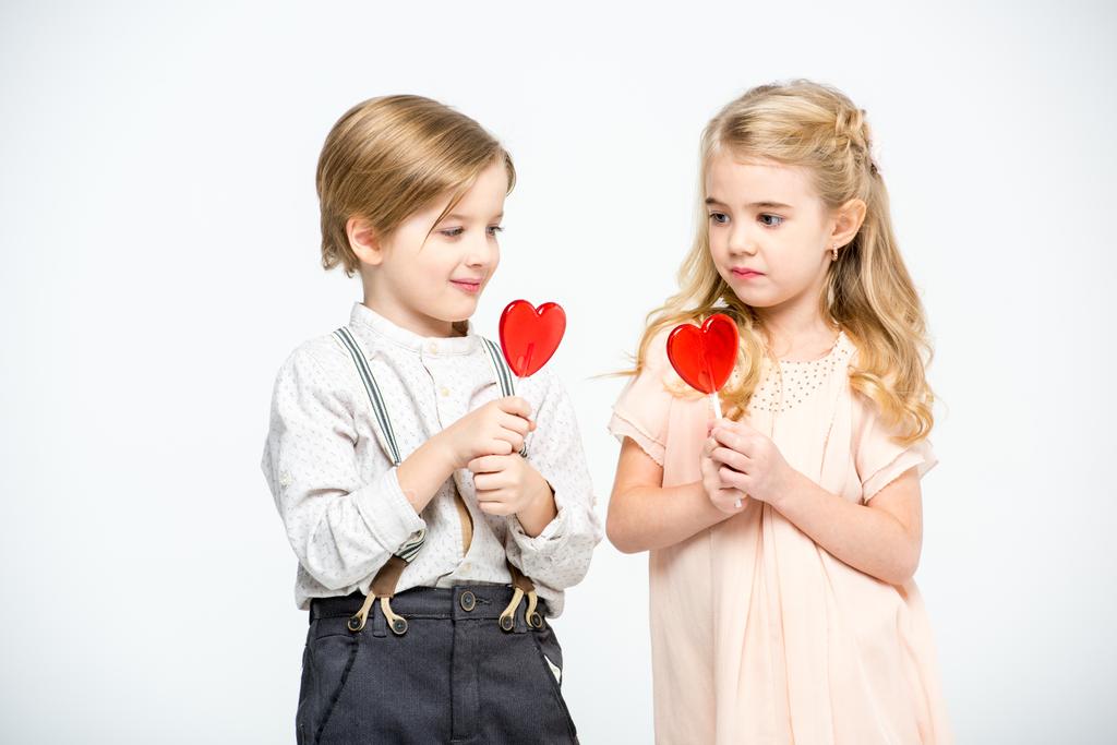 Kids with heart shaped lollipops - Photo, Image