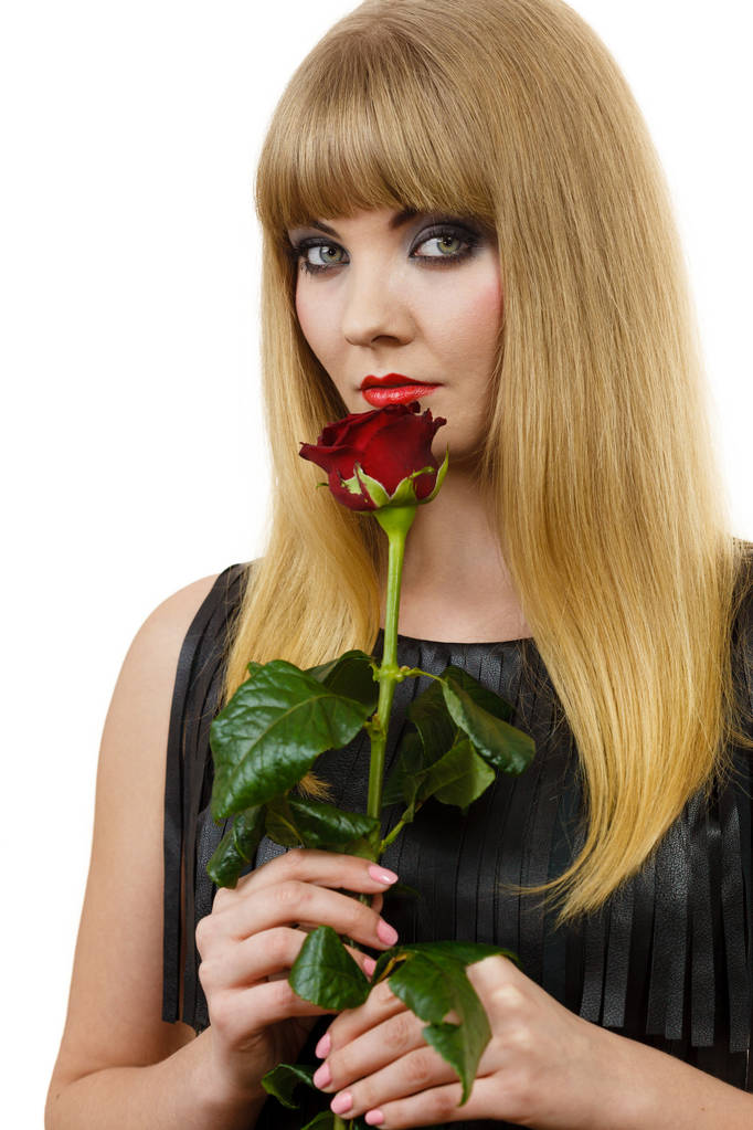 Beautiful young lady with red rose. - Photo, Image