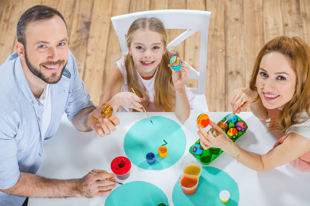 Family painting Easter eggs - Photo, Image