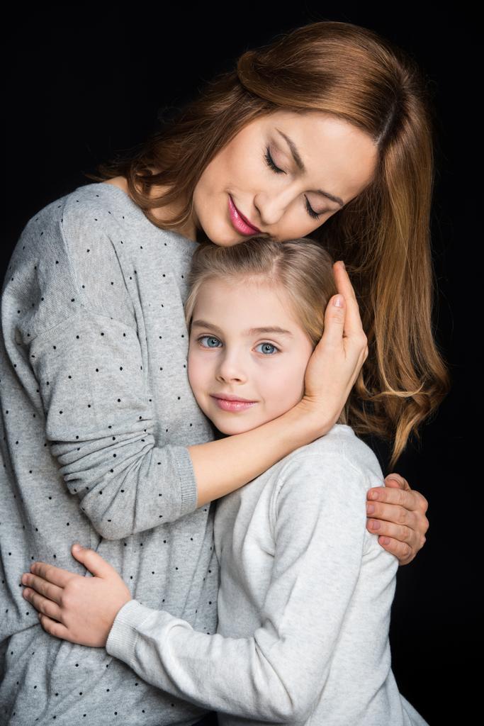 Mother and daughter hugging - Photo, Image