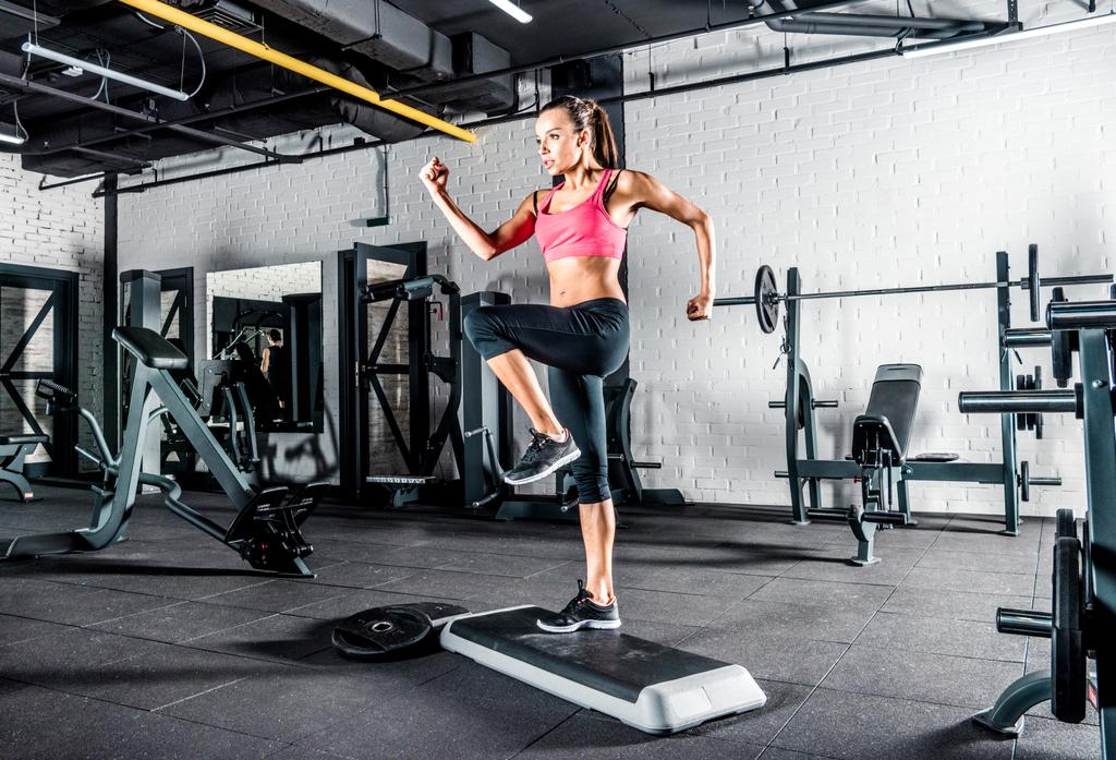 Woman exercising in gym  - Photo, Image