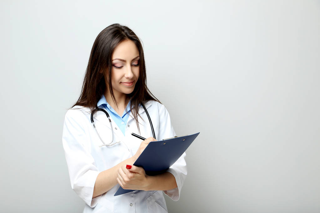 Female Doctor with clipboard  - Photo, Image