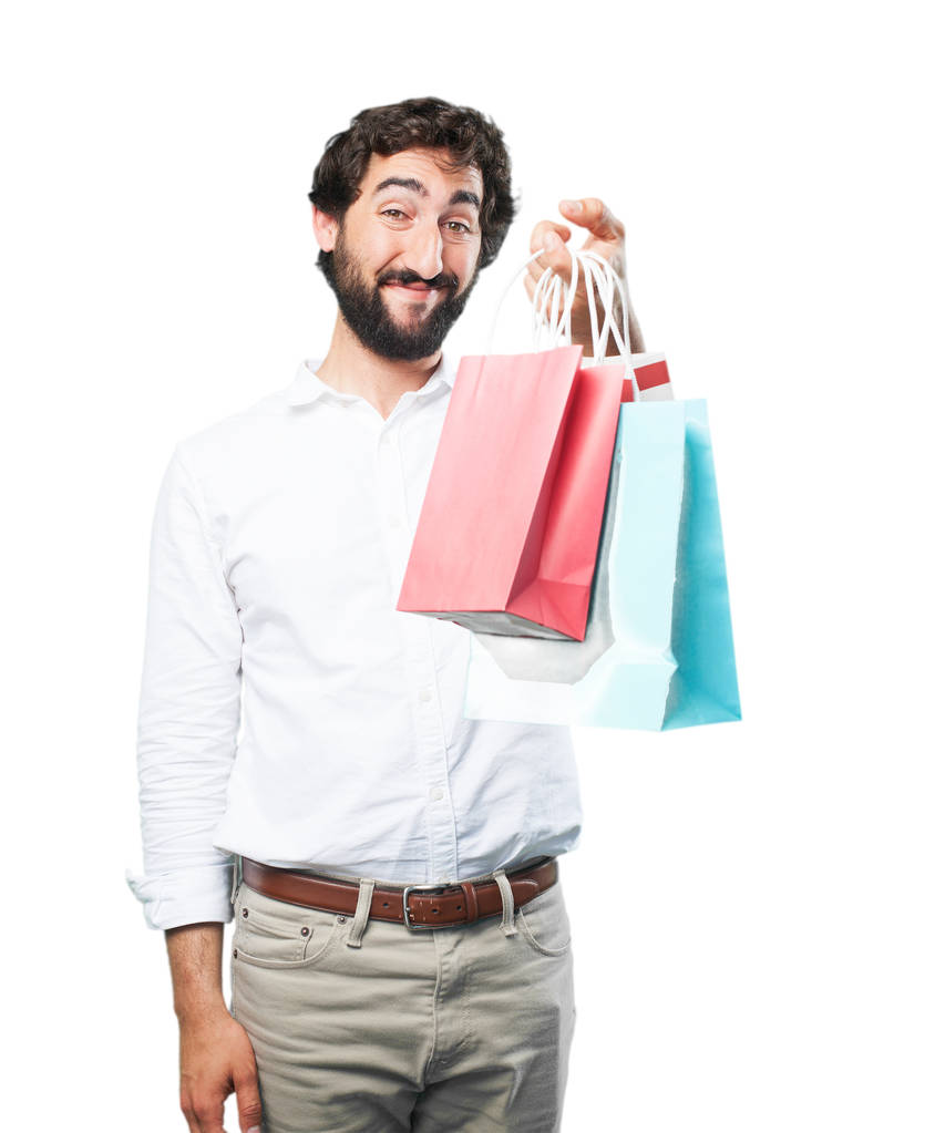 Junger lustiger Mann mit Einkaufstüten - Foto, Bild