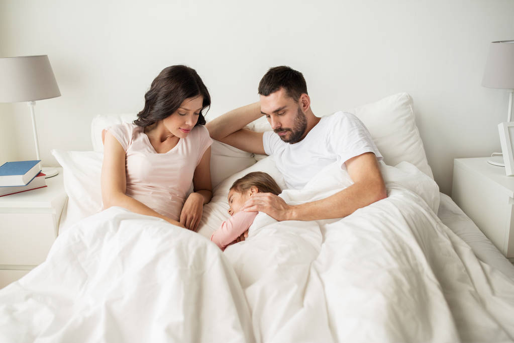 happy family sleeping in bed at home - Photo, Image