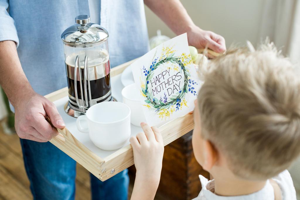 Father and son holding tray with card  - Photo, Image