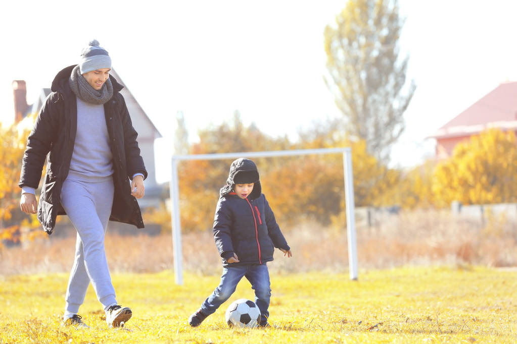 Father and son playing football - Photo, Image