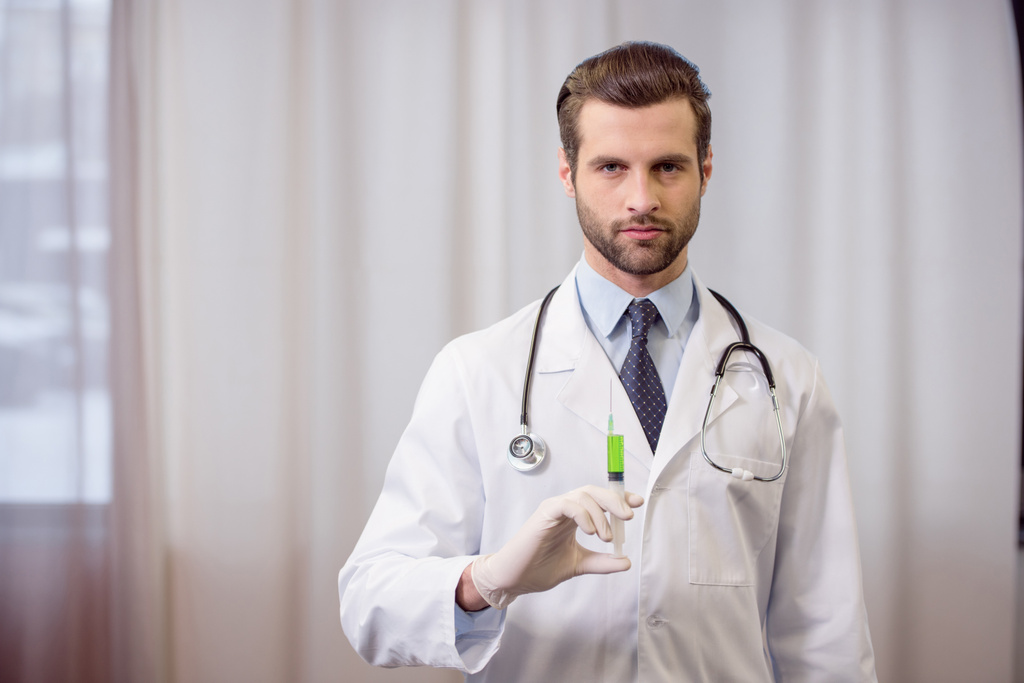 Doctor holding syringe - Photo, Image