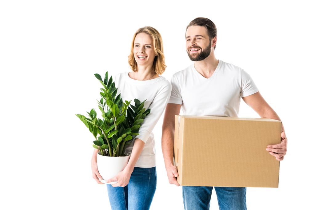 Couple holding box and plant - Photo, Image