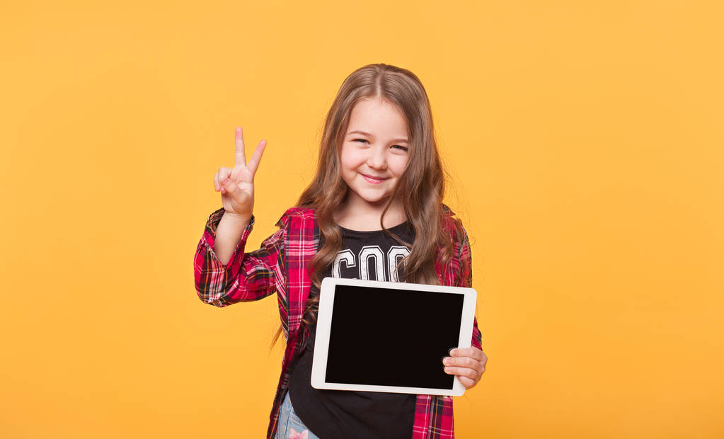 Happy child with tablet computer. Kid showing - Photo, Image
