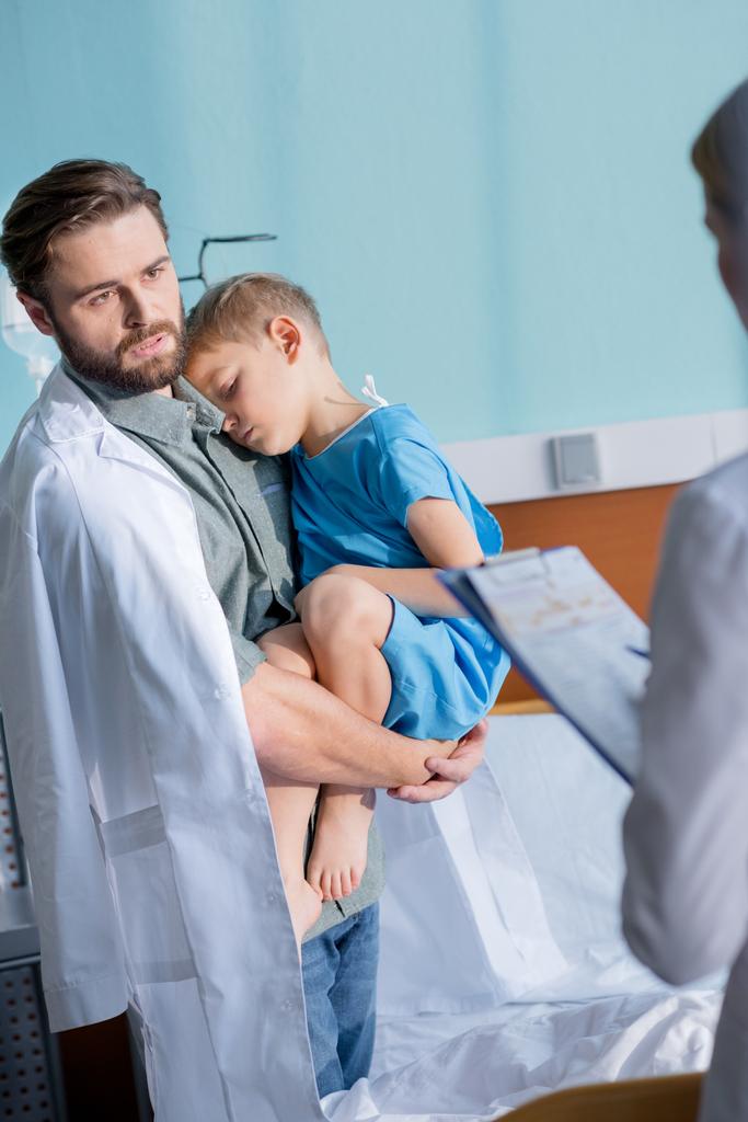 Father and son visiting doctor  - Photo, Image