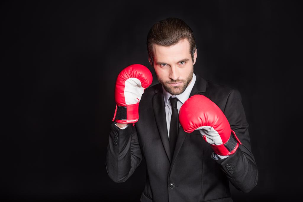 Empresario en guantes de boxeo
 - Foto, imagen