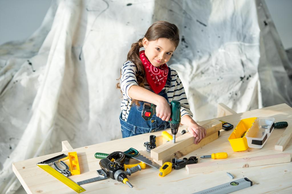 Little girl with tools - Photo, Image