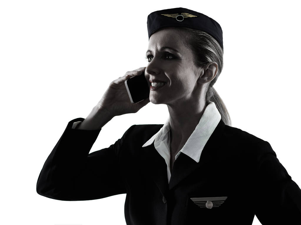 Stewardess légiutas-kísérő személyzet nő a telefon sziluett - Fotó, kép