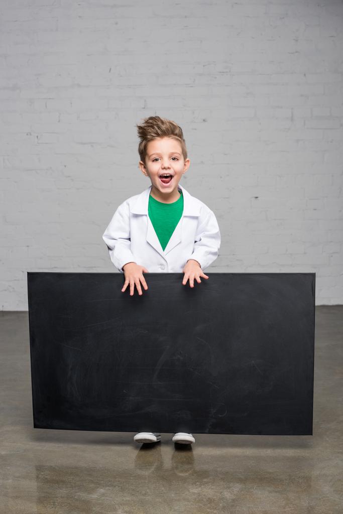 Boy holding blackboard   - Photo, Image