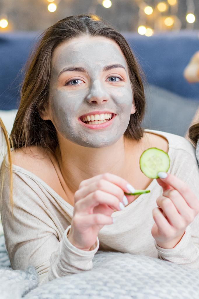 Young woman with facial mask   - Photo, Image