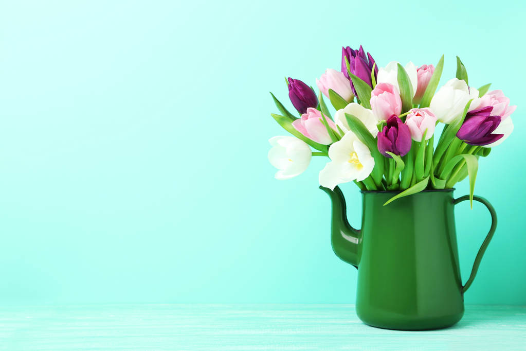 Bouquet of tulips in green jug - Photo, Image
