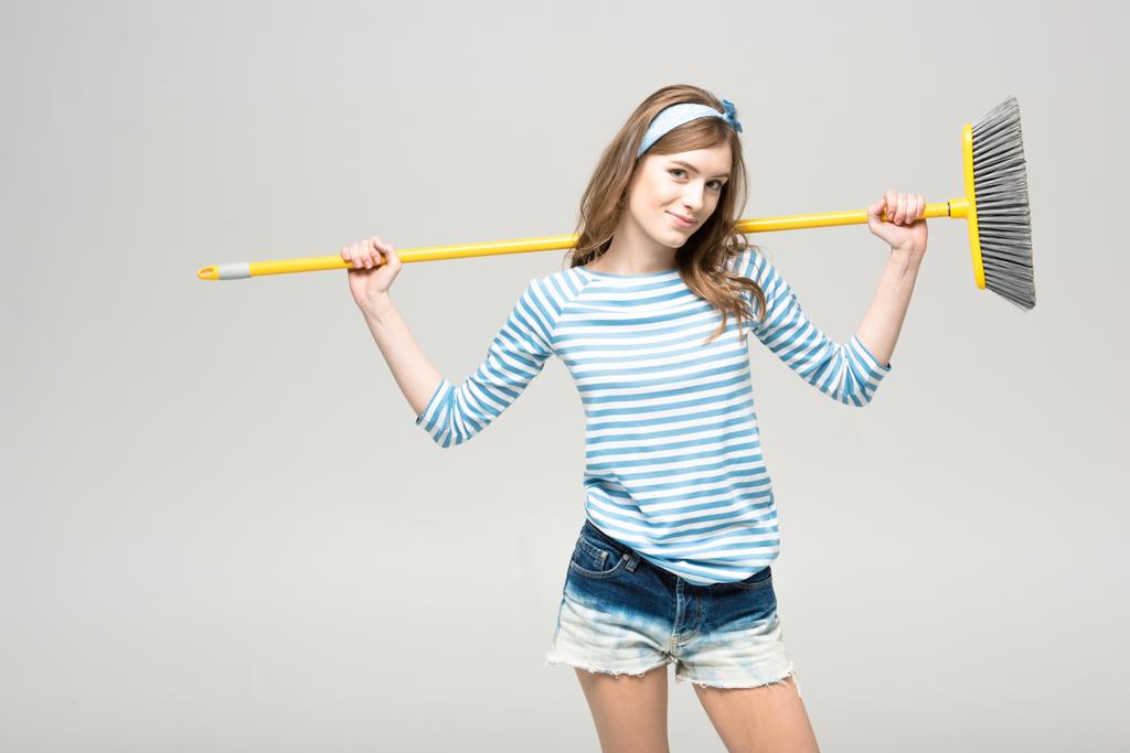 Young woman with broom - Photo, Image