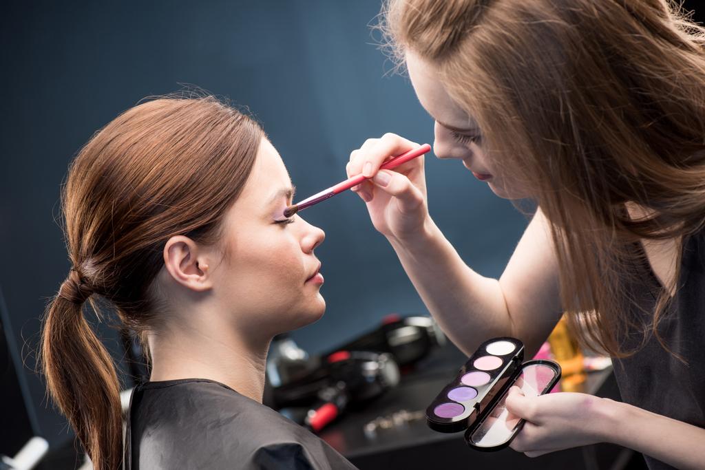Make-up artist applying eyeshadow - Photo, Image