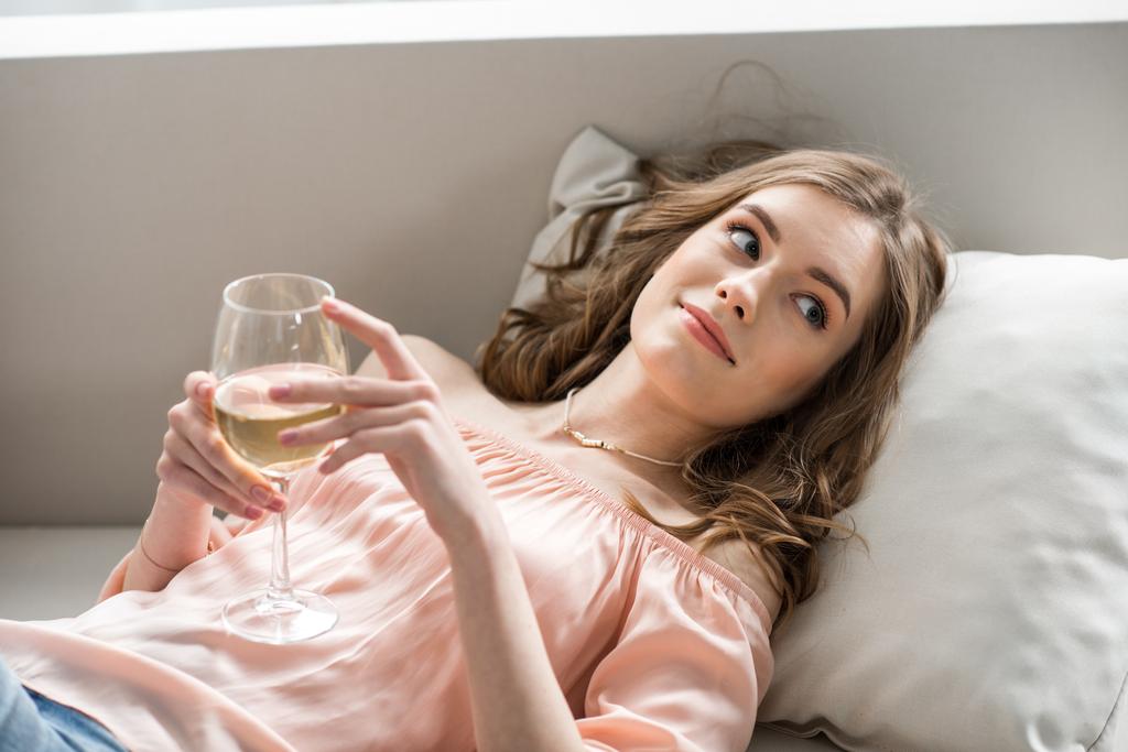 Woman holding glass of wine  - Photo, Image