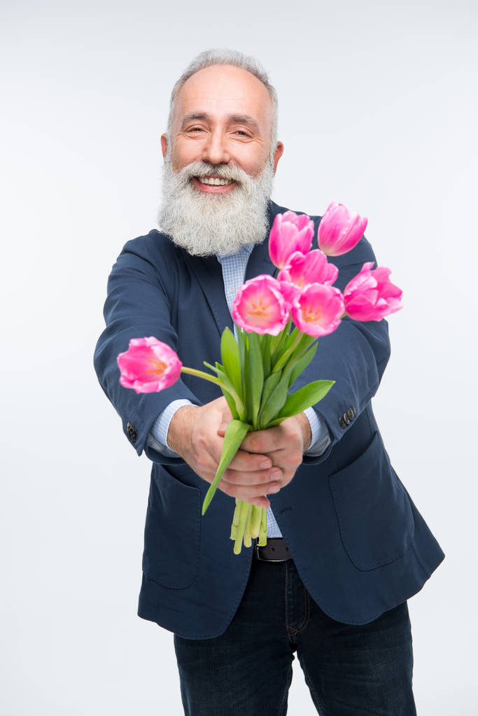 Idősebb ember, tulipán  - Fotó, kép