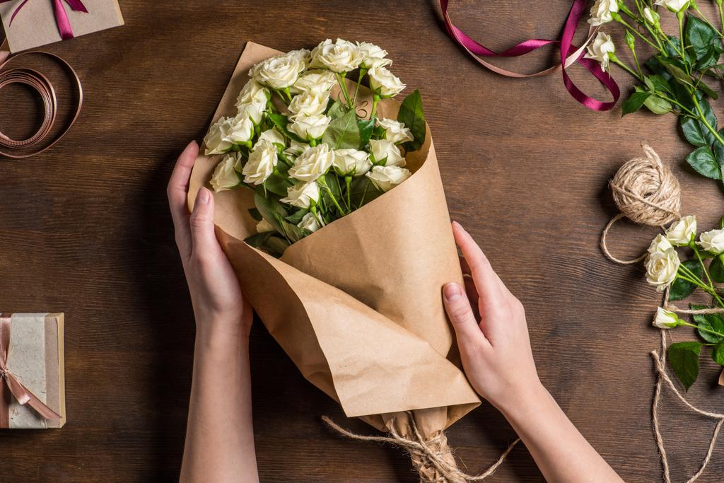 hands holding roses bouquet - Photo, Image