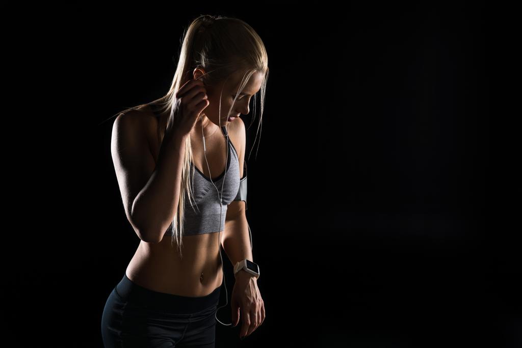 спортивна жінка з навушниками
 - Фото, зображення