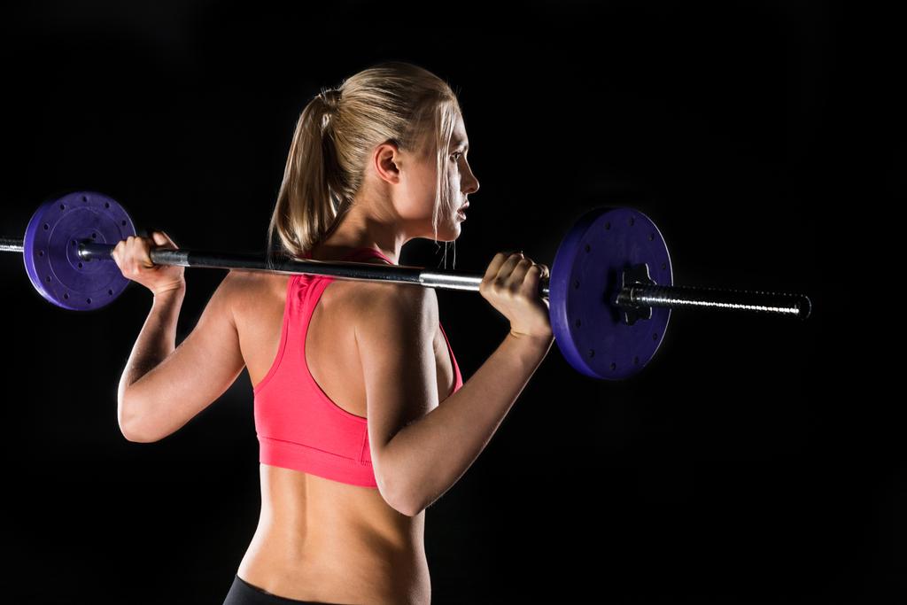 woman exercising with barbell - Photo, Image
