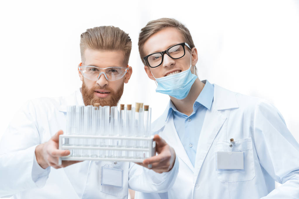 Chemists holding test tubes - Photo, Image